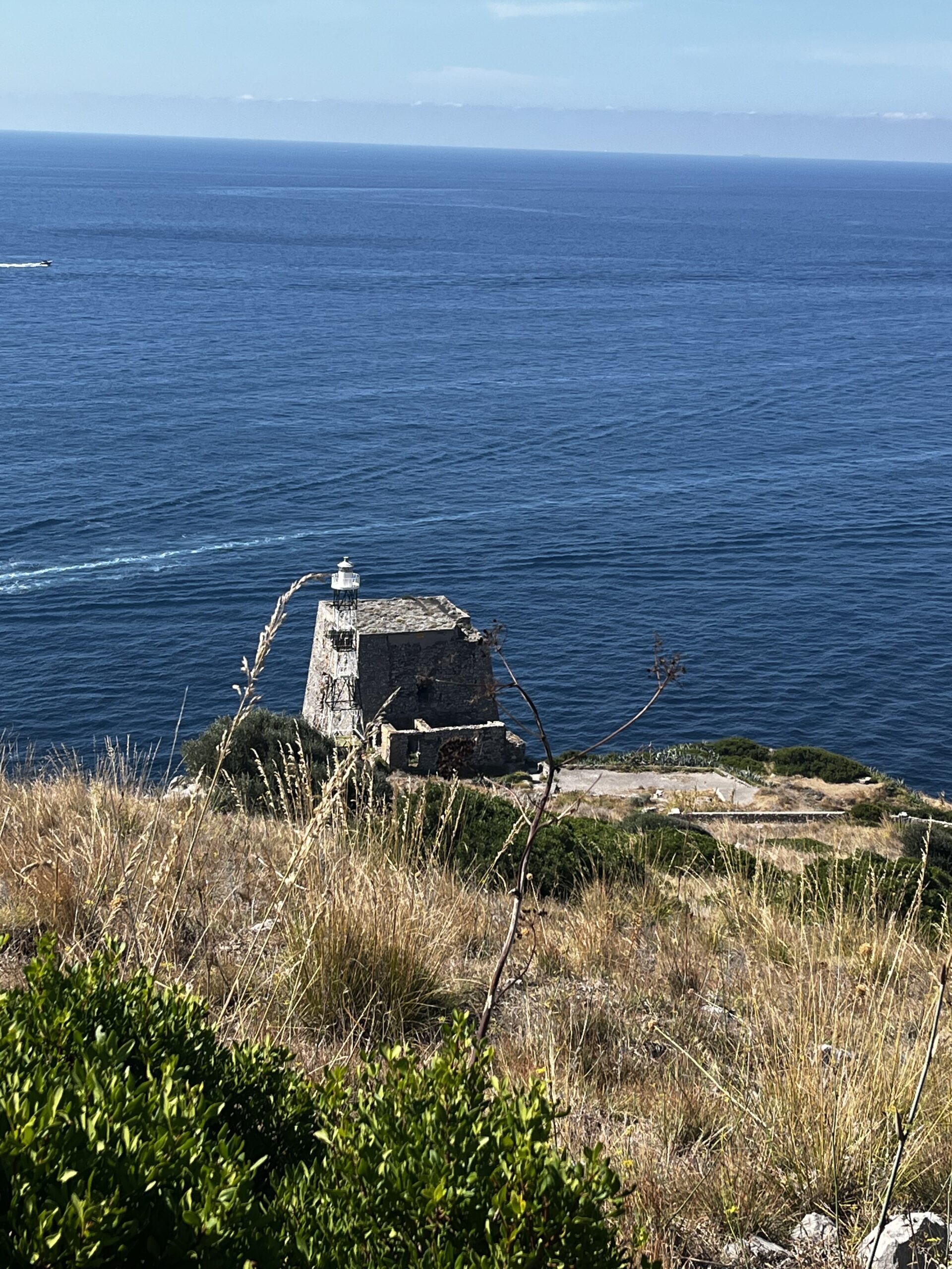 watchtower of Punta Campanella, taking in the historic structure against the backdrop of the sea and coastal beauty. A contemplative scene in the midst of Sorrento's natural wonders.