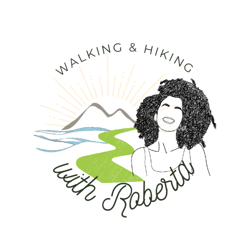 Logo featuring a vibrant sun rising over majestic mountains, with scenic Amalfi Coast trails in the background. A smiling girl leads a group of hikers, capturing the joy and camaraderie of our hiking adventures in Sorrento, Amalfi Coast, and Capri with 'Hiking with Roberta